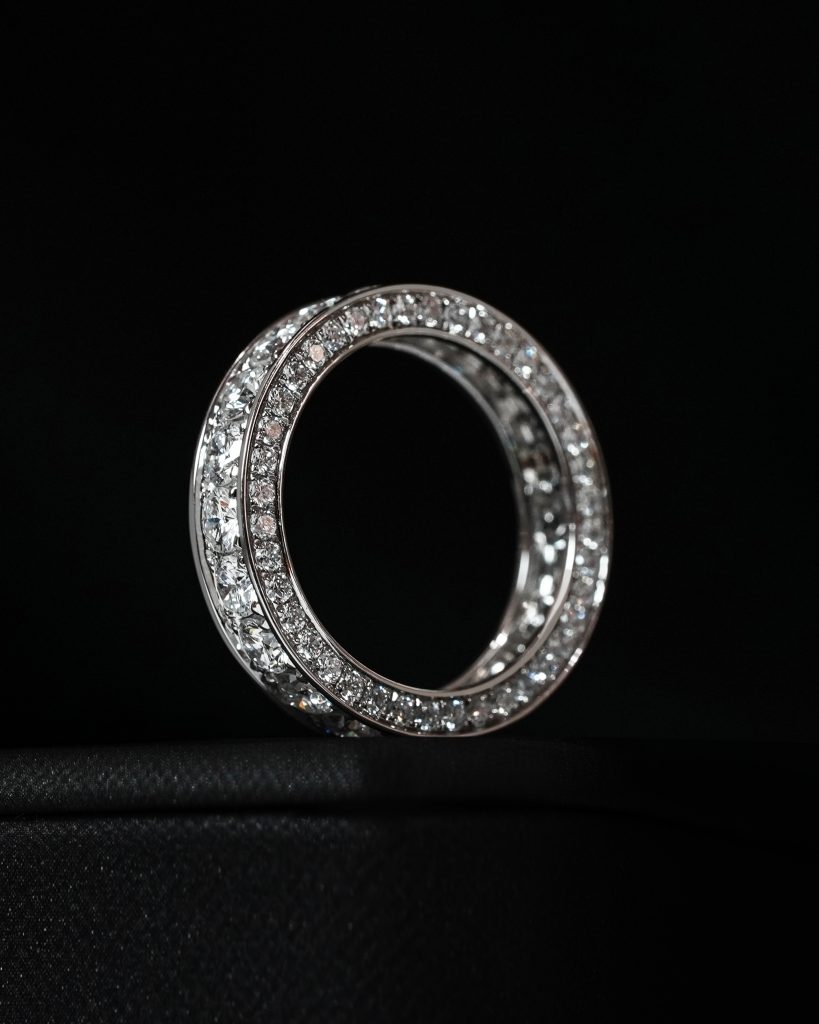celina-half-eternity-ring-black-bg. Celina Half Eternity Ring – round cut diamonds on black background