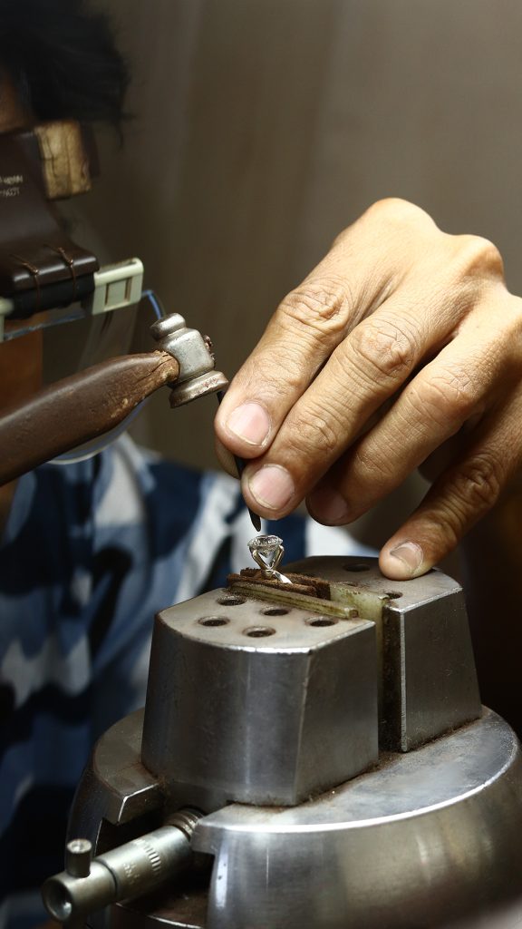 Close-up of ring engraving with precision tool