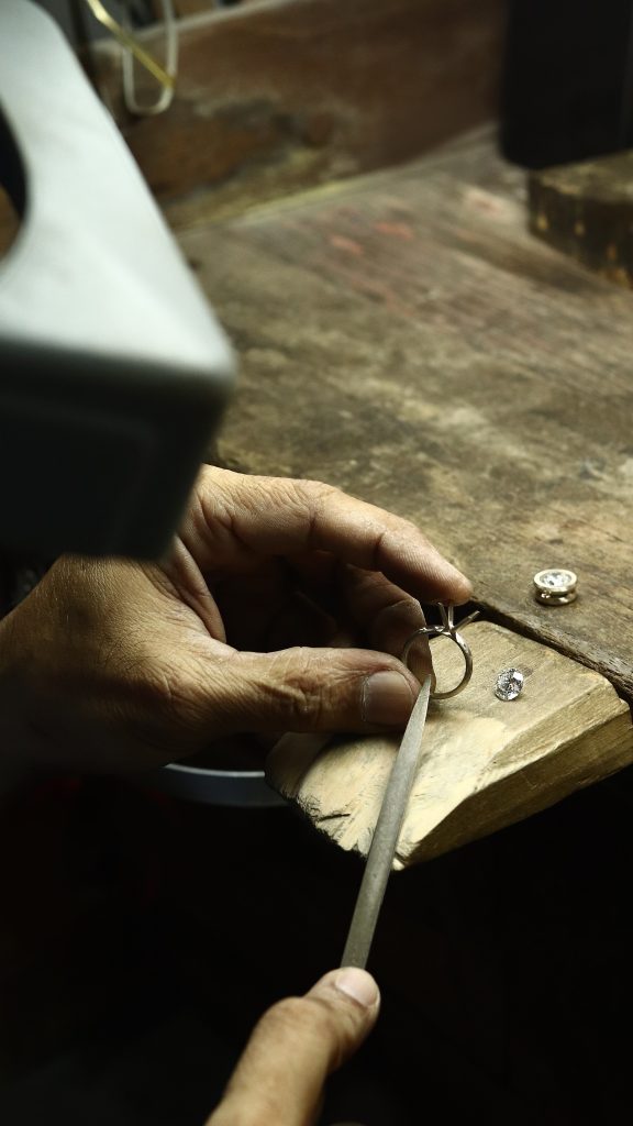 Hand polishing gold ring